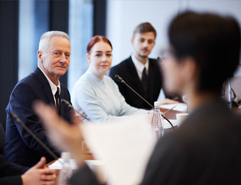 ASQA Review | CAQA Publications Business professionals discuss the ASQA review during a meeting, highlighting important vet training resources.