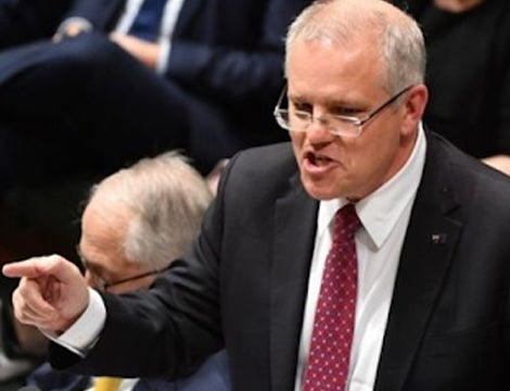 Scott Morrison | CAQA Publications Scott Morrison points while speaking during a parliamentary session in Canberra, discussing vocational education and.